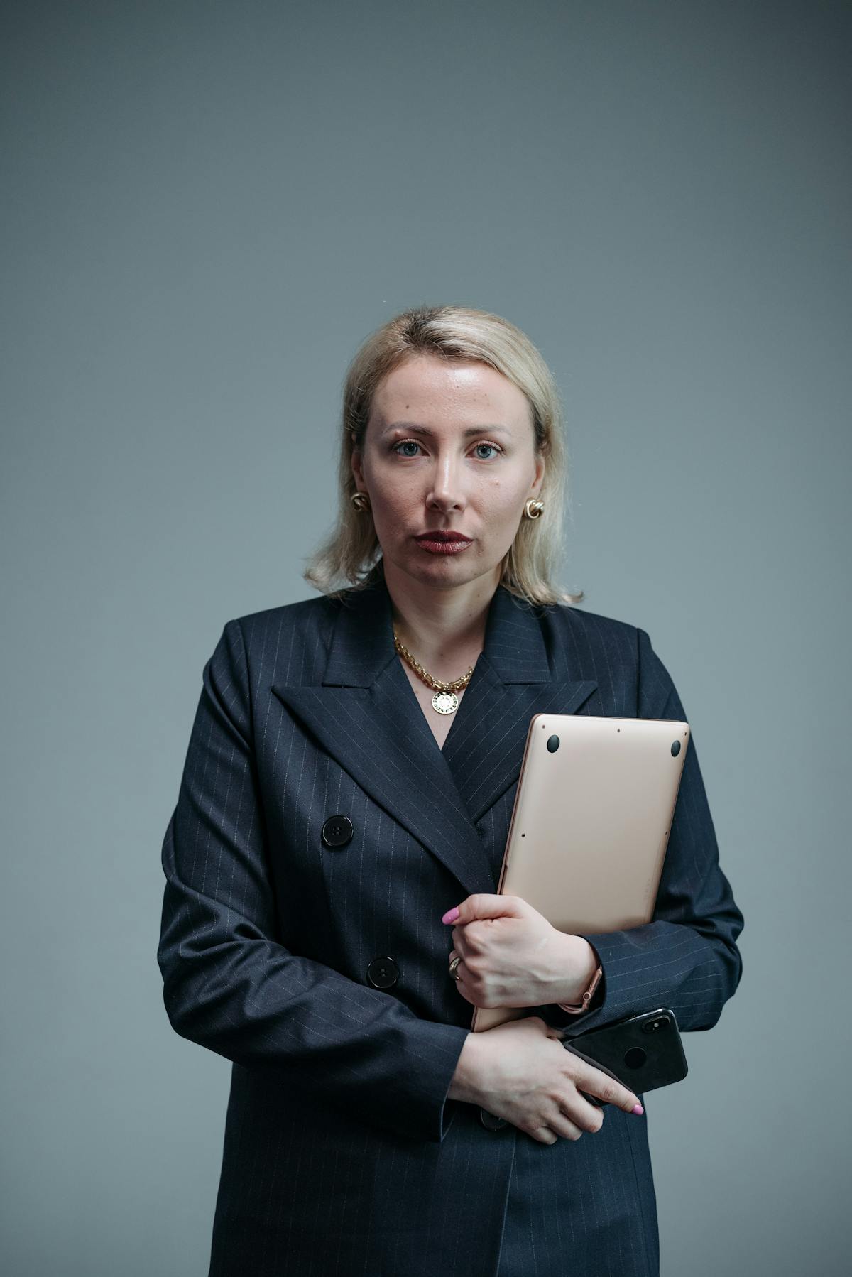 Woman in business attire holding her future